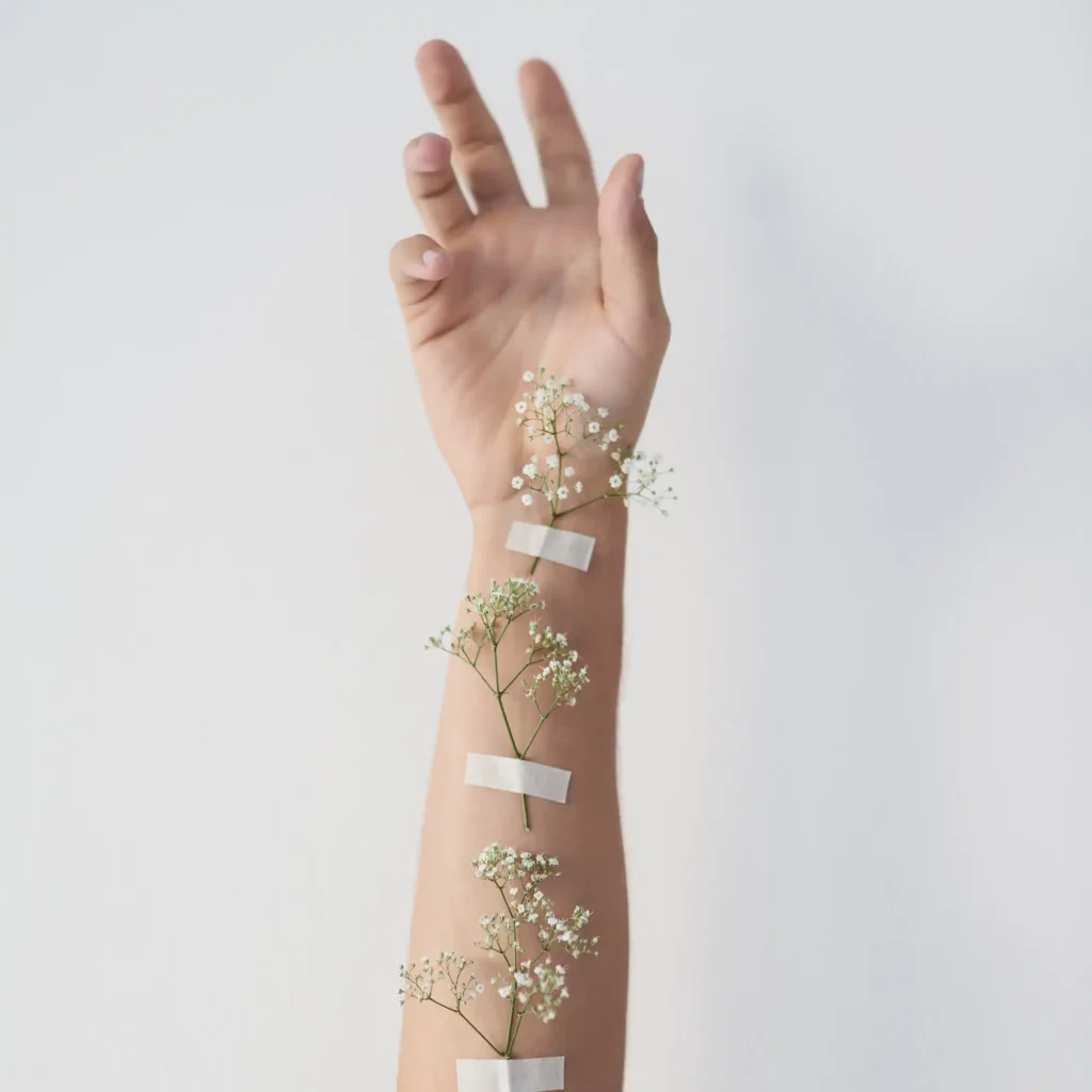 Allergologie München grow with me cropped shot of plants taped to an underarm